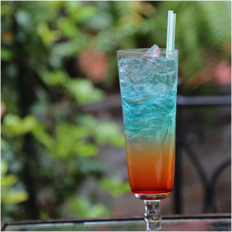 Rainbow cocktail in a tall glass 