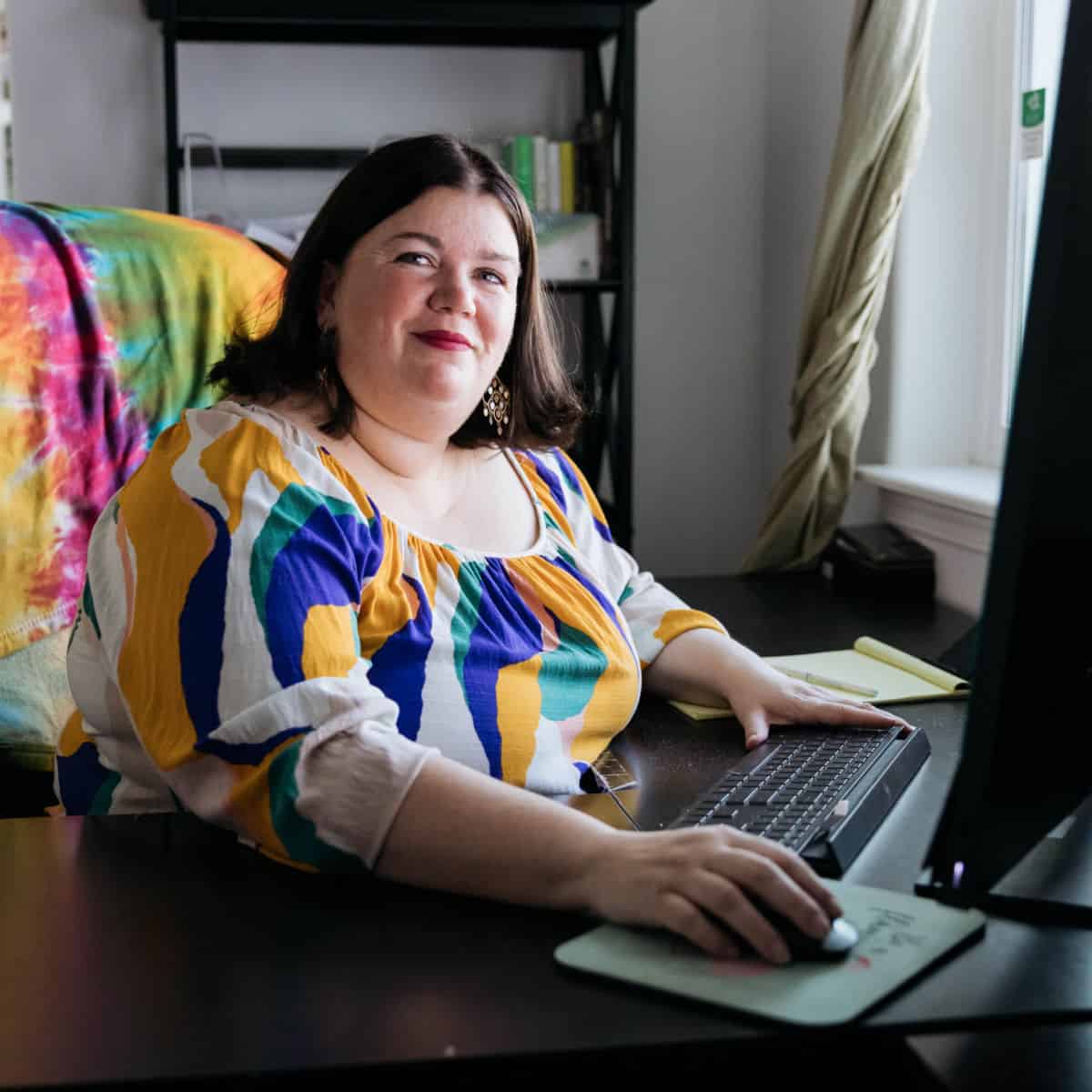 Tammilee working at computer in home office