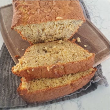 Slices of 3 ingredient banana bread on a wood board