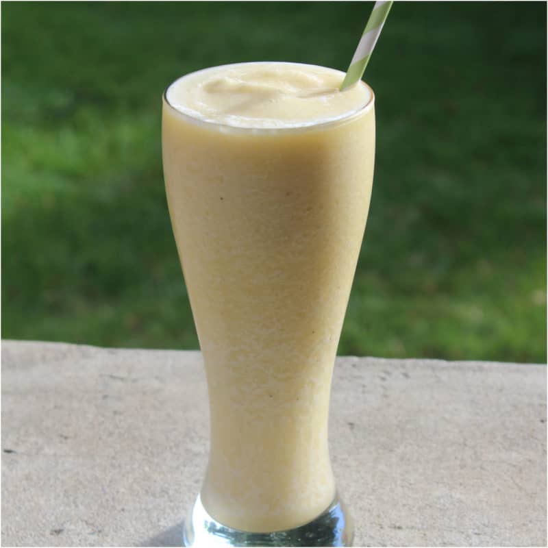Banana Julius in a tall glass with paper straw