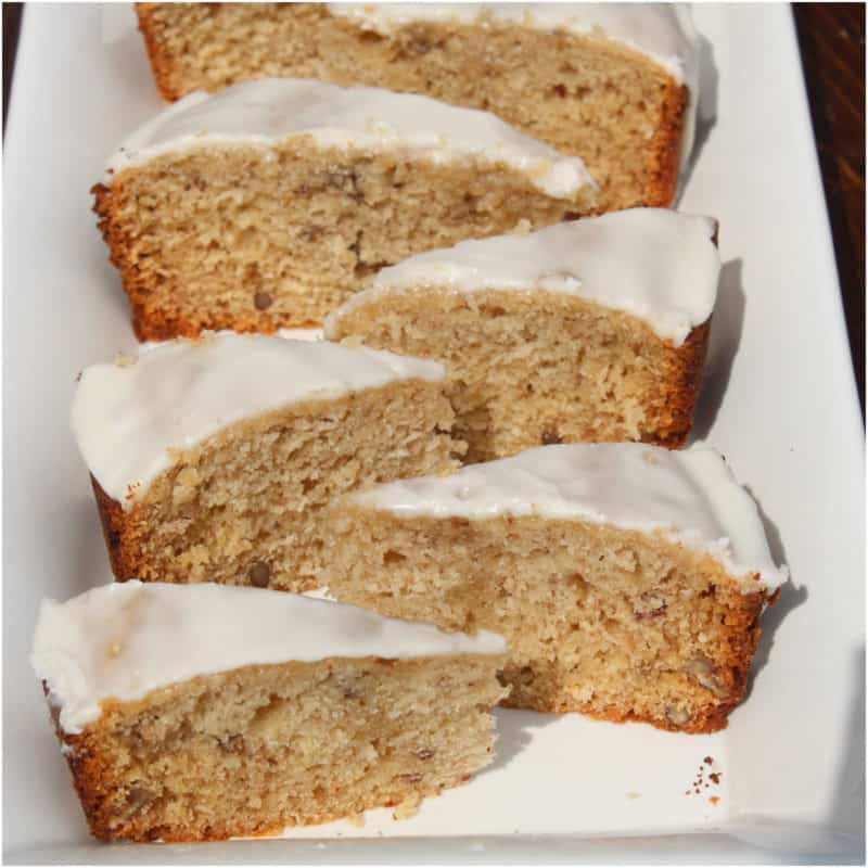 Slices of bourbon banana bread on a white platter