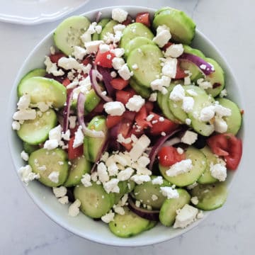 Greek Cucumber Salad with Feta in a white bowl