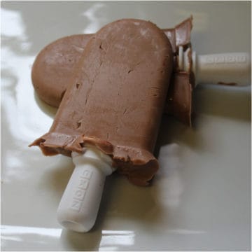 Two Nutella Popsicles on a white platter