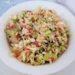 Sauerkraut Salad in a white bowl next to a fork