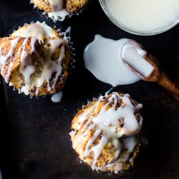 Maple monkey bread bites on a dark board with icing smear