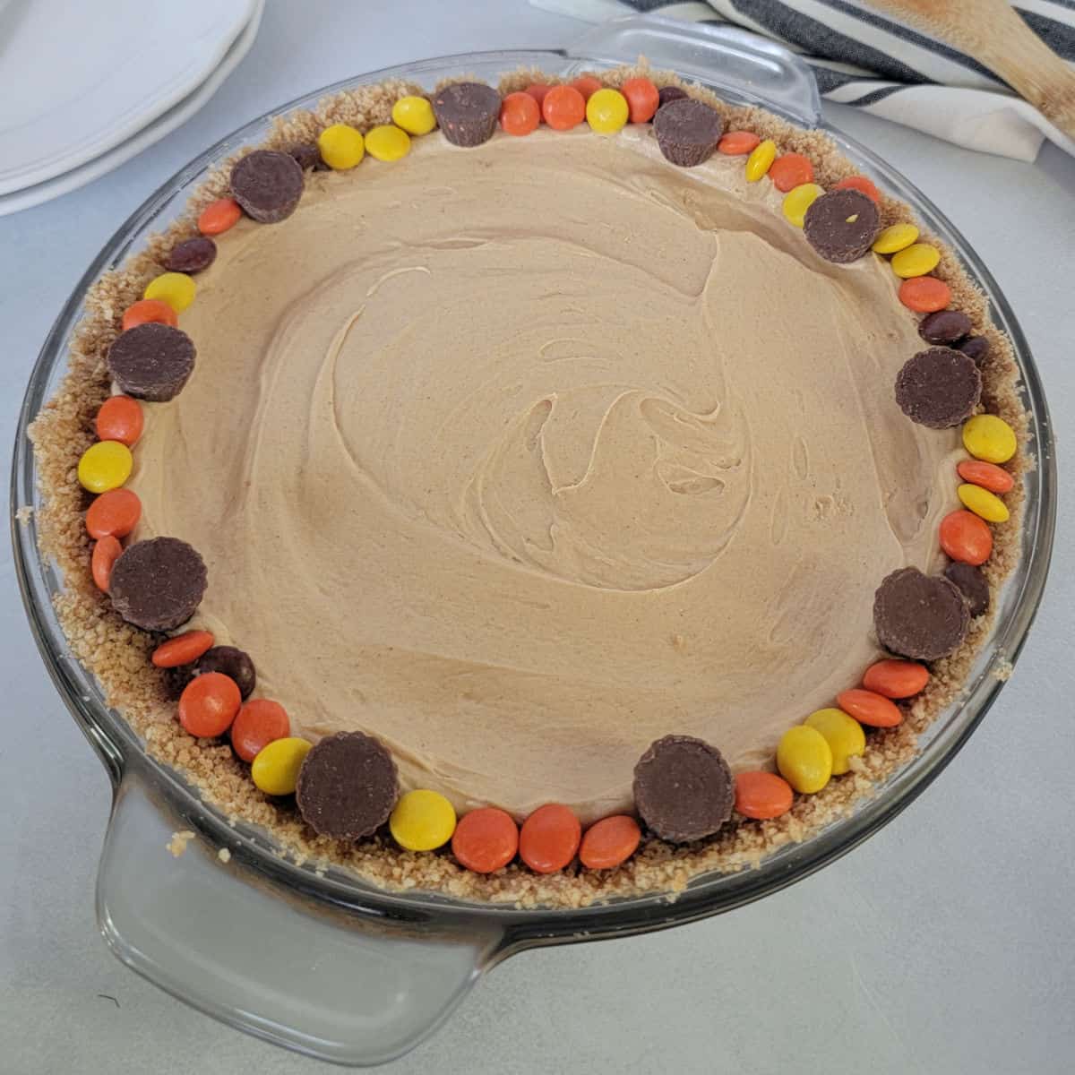 No bake peanut butter pie rimmed in reeses pieces