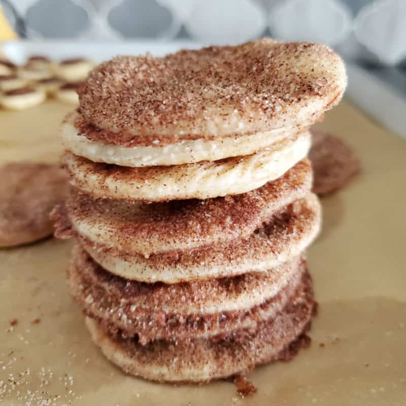 Stack of pie crust cookies on parchment paper