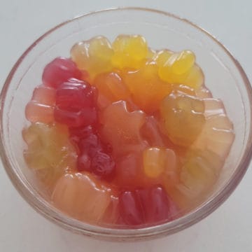 Vodka gummy bears in a glass dish