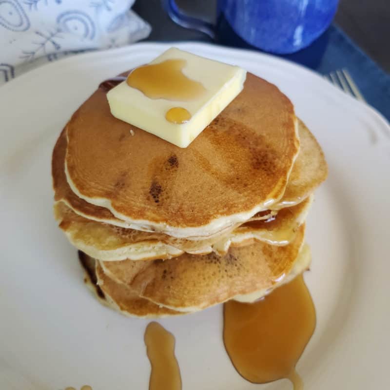 Stack of muffin mix pancakes with butter and syrup
