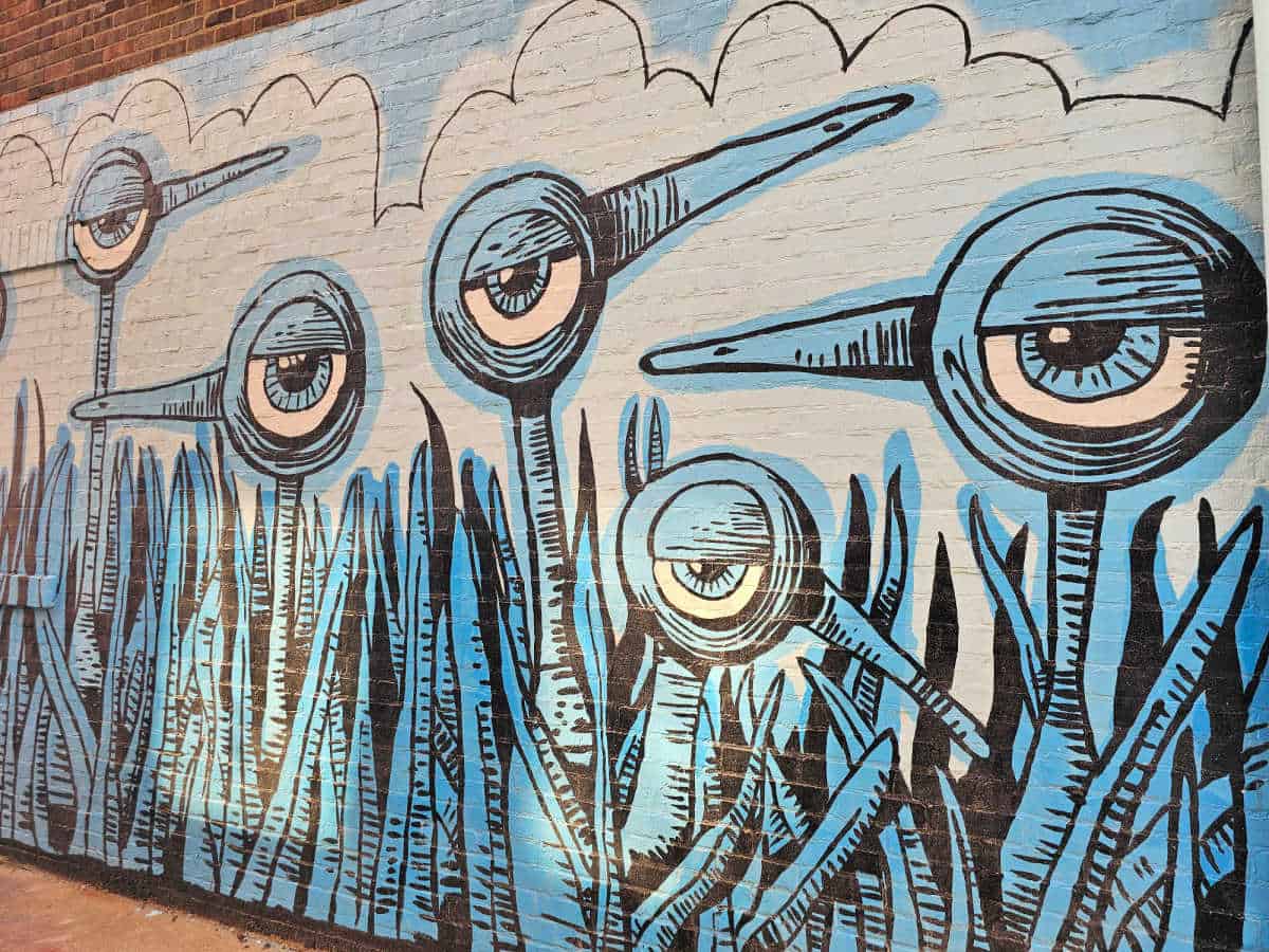Blue bird mural with blue grass