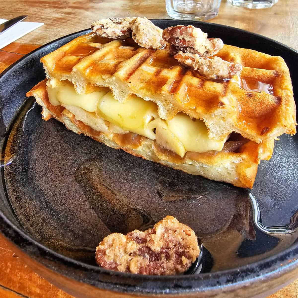 Waffle and cheese sandwich with candied pecans