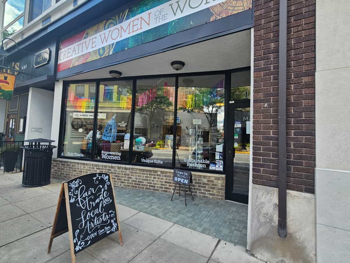 Creative women of the world sign over the entrance to the gift shop