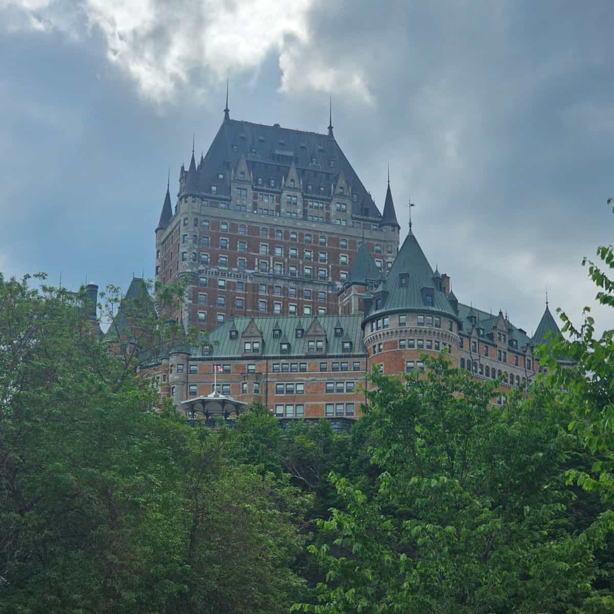 Fairmont Le Chateau Frontenac on a hill above the trees