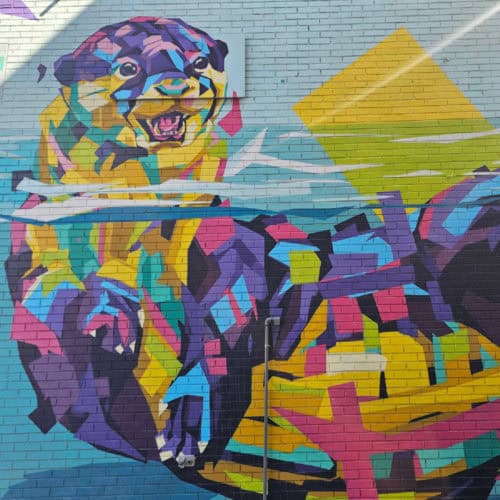 Otter mural in fun bright colors