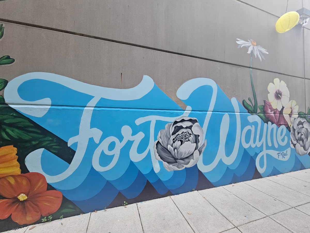 Fort Wayne mural with flowers and Fort Wayne on the wall