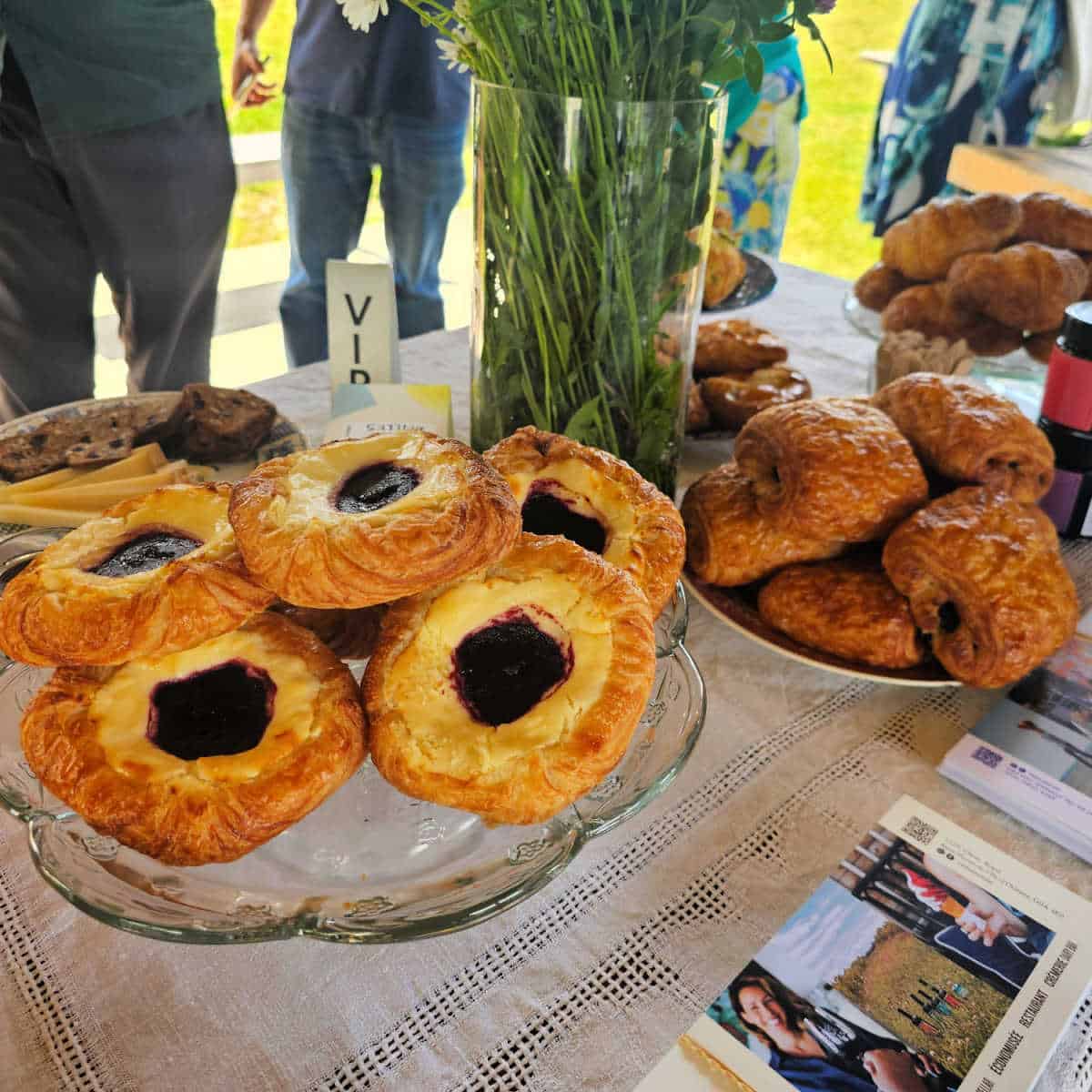 Pastries on a table with La Midinette bakery info