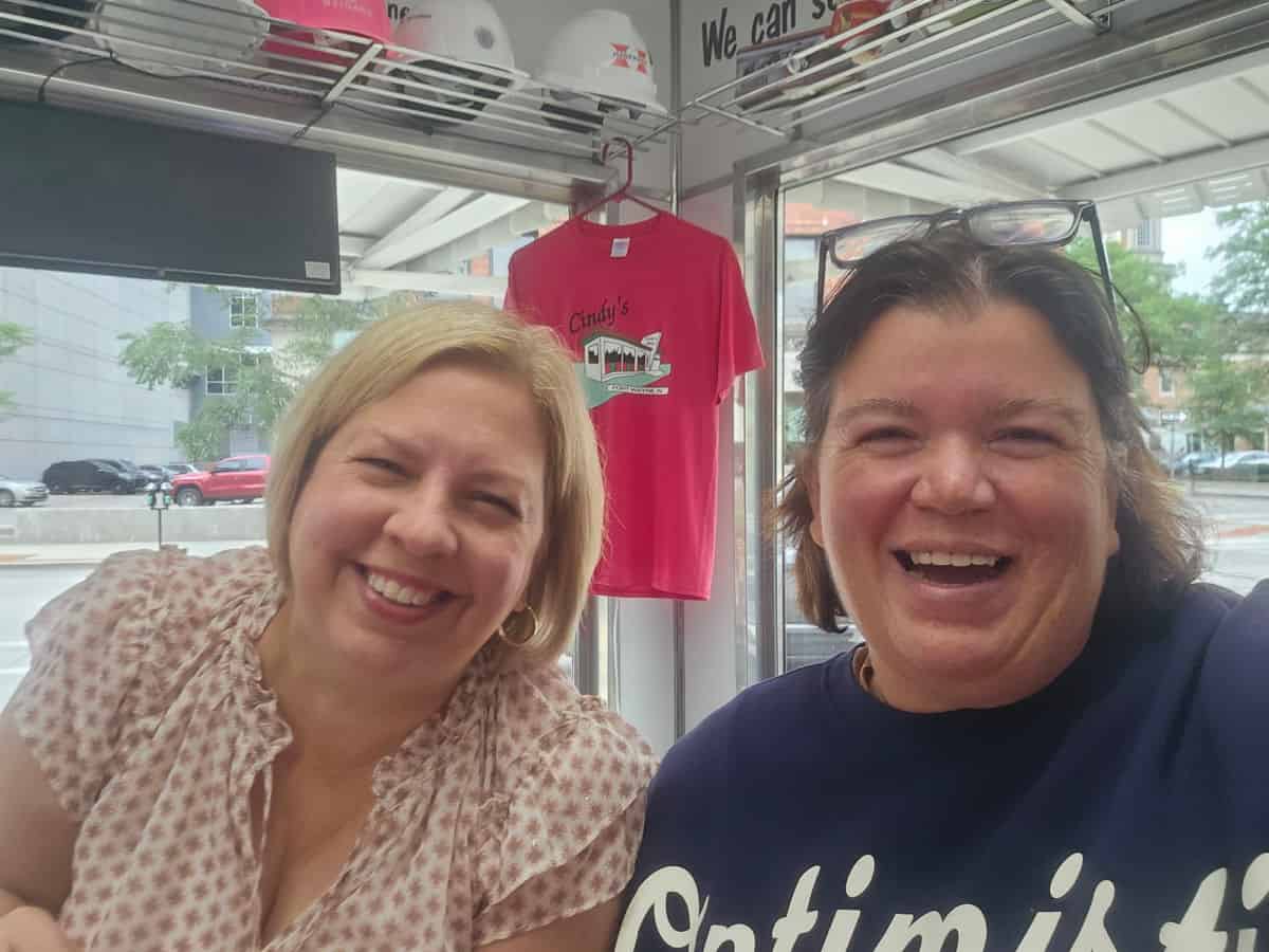 Tammilee and Kim laughing in Cindy's Diner