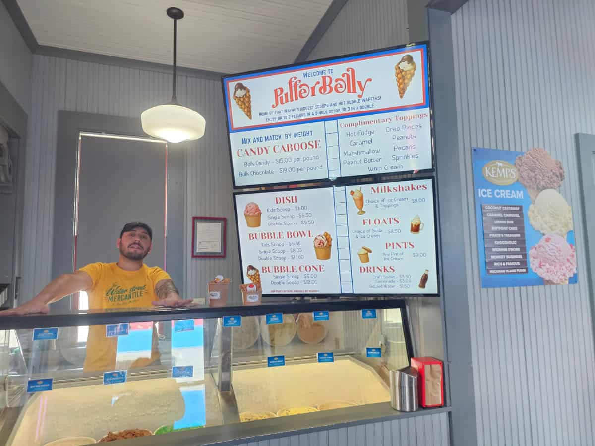 puffer belly menu with employee standing next to the ice cream stand