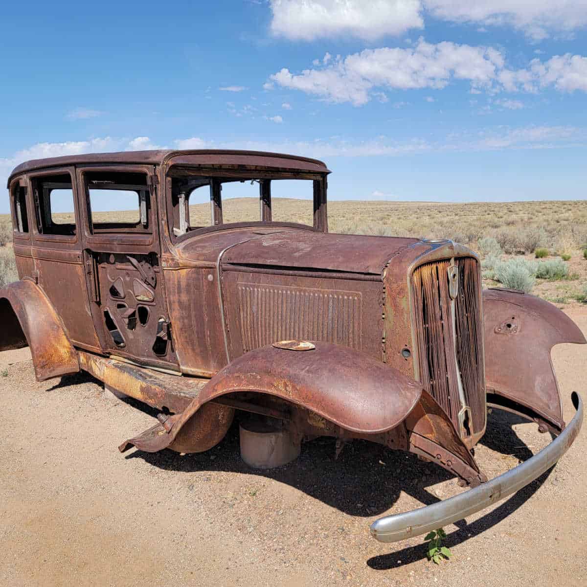 rust covered historic car in Petrified Forest NP on Route 66