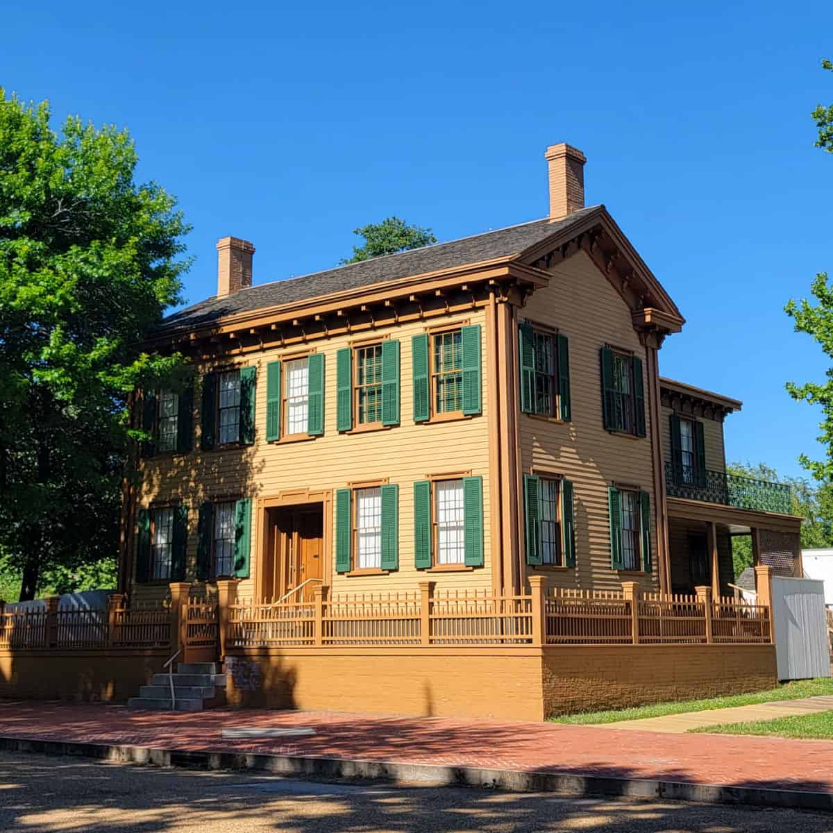 tan house with green shutters and brick walkway, lincoln home national historic site, springfield illinois